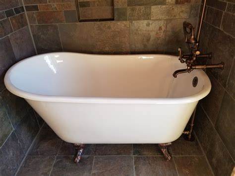 These pegs are finished with a claw design, lending the name of clawfoot. Clawfoot Bathtub and Custom Tile | Gettysburg, PA