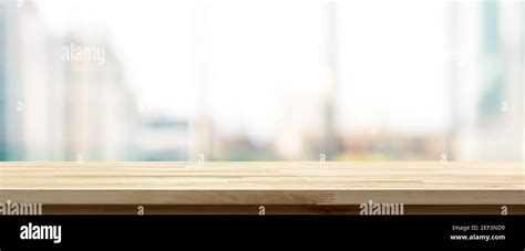 Wood Table Top On Blur City Building View Background Looking Through