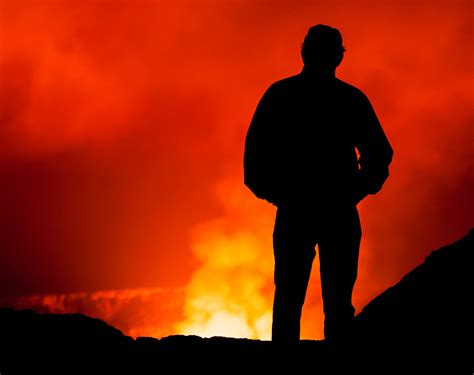man looking into kilauea volcano hawaii volcanoes national park fred wasmer photography