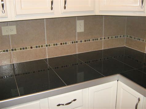 Let us help you with your home improvement project. Black granite floor tile counter top | Tile countertops ...