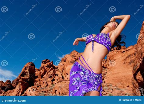 pretty bellydancer dancing in the desert stock image image of rocks beautiful 13205241