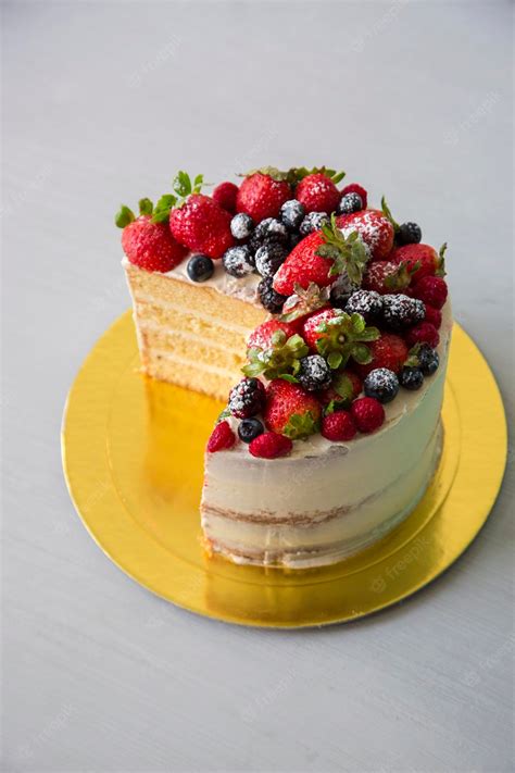 Premium Photo Strawberry And Blueberry Semi Naked Cake Small Layered Pastry With Buttercream