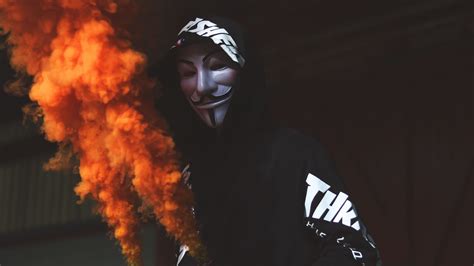 Download Wallpaper Anonymous Mask And Orange Smoke 3840x2160