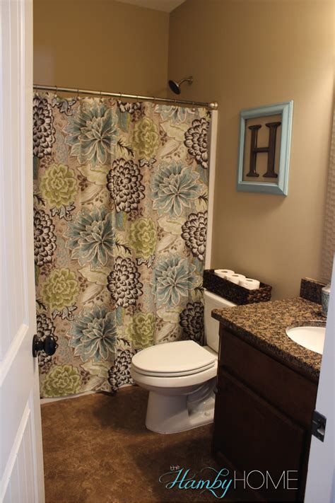 Hang fabric from the ceiling to add visual height and make your bathroom look and feel larger. TGIF House Tour - Guest Bathroom - The Hamby Home