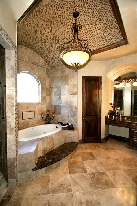 Luxury Bathroom In Tuscan Style With A Bathtub And Beige Travertine