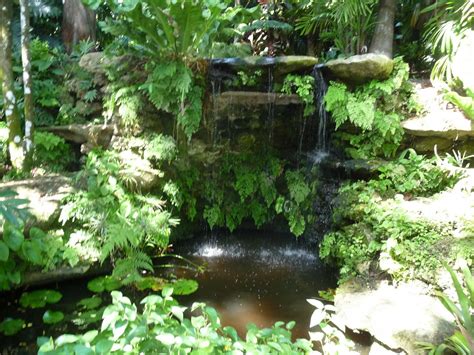 The look is as real as it gets as we capture real rock formations that uses natural oxides for the surface coating. a grotto in a sunken garden | Garden waterfall, Beautiful ...