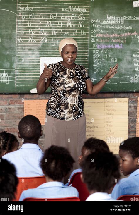 African Teacher Teaching A Class Full Of Students Stock Photo Alamy