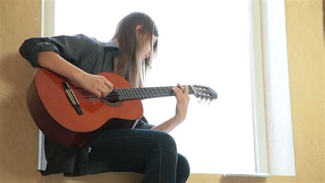 Teen Girl Playing Guitar At Stock Footage Video 100