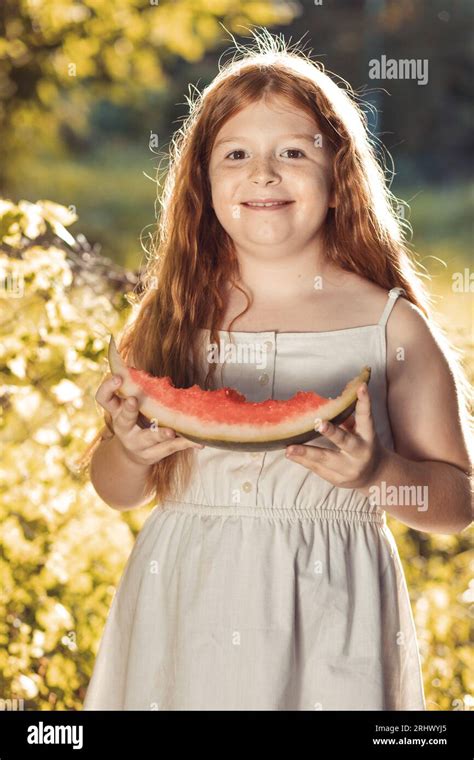 Cute Little Girl Eating Watermelon Outdoors Stock Photo Alamy
