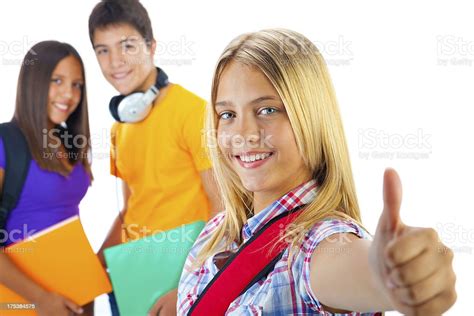 Teenage Students Giving Thumbs Up Stock Photo Download Image Now