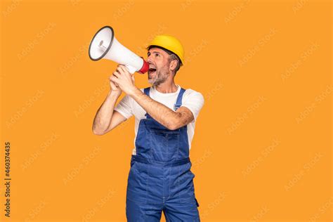 Handsome Happy Construction Worker Shouting Loud By Megaphone With