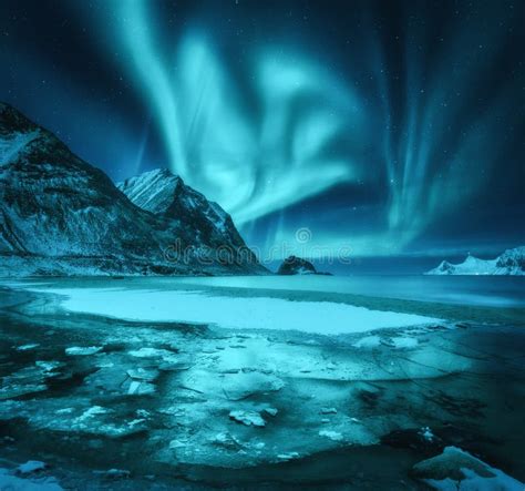 Northern Lights Over Snowy Mountains Frozen Sea Coast Stock Image