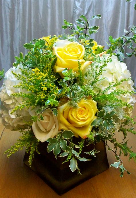 Free deliverywithin dubai on orders over aed 200 order by 3pmfor same day delivery need help?call +971 58 9001905. low centerpiece yellow rose white hydrangea square gold ...