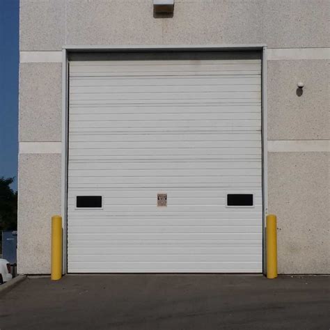 The lock bar could be poorly aligned. Insulated Overhead Sectional Door | Canuck Door Systems