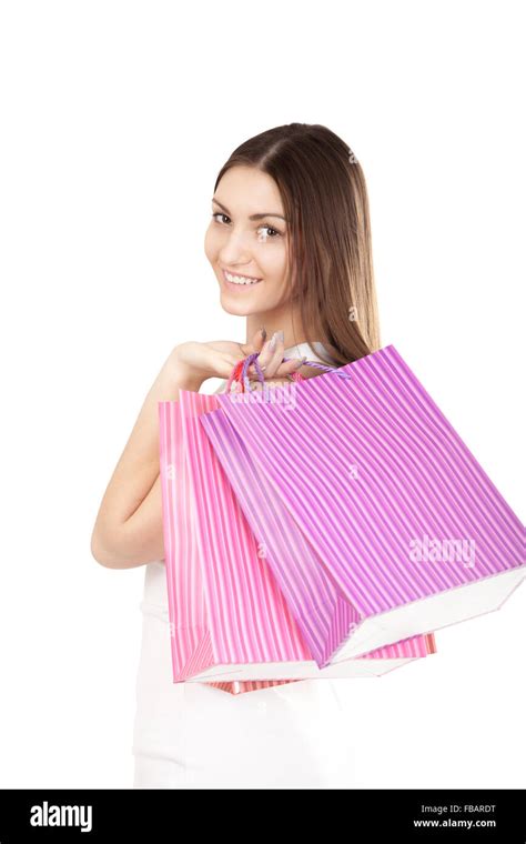 Portrait Of Smiling Female Holding Colorful Shopping Bags Isolated On