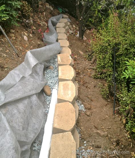 What's the right slope for a french drain? Retaining Wall on a Slope - Simple Practical Beautiful