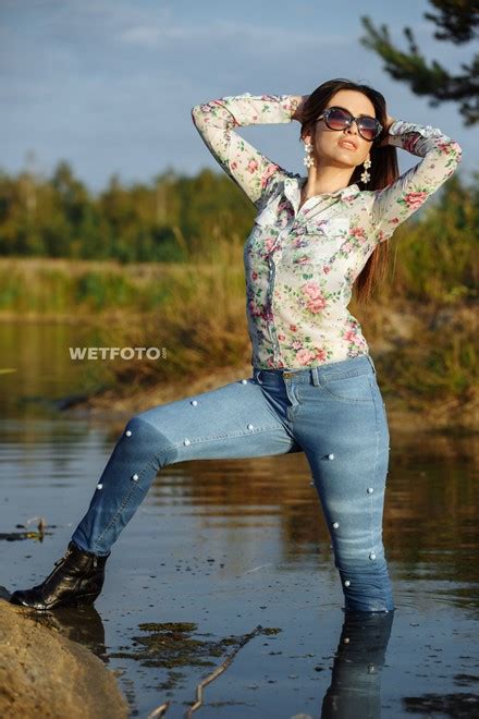 Fully Clothed Girl In Tight Jeans Shirt And Boots Get Soaking Wet On Lake