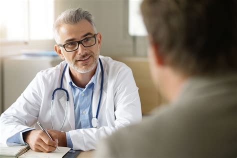Doctor Speaking To Patient About Colorectal Cancer Slma