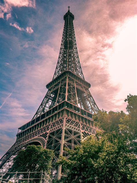 There are four gateways at the four. Eiffel Tower in Paris France · Free Stock Photo