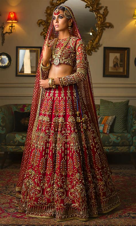 red bridal lehenga for indian wedding with heavy designer work and two dupatta klothtrend