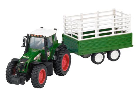 Ein bauer fährt mit seinem traktor zum bauernhof zurück. Spielzeugtraktor Traktor Trecker mit Anhänger Bauernhof ...