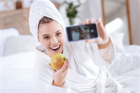 Upbeat Woman Taking Selfie With Apple After Shower Stock Photo Image