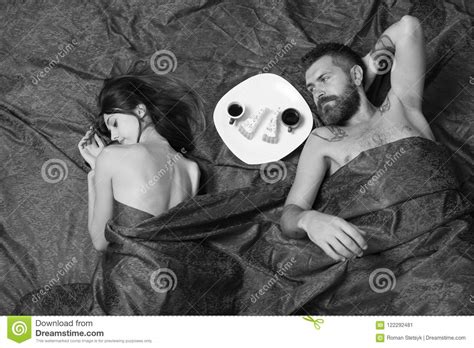 Love And Sex Concept Couple In Love On Burgundy Sheets Stock Image