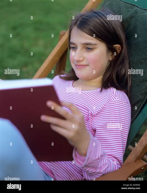 Young Girl Reading Book Stock Photo Alamy
