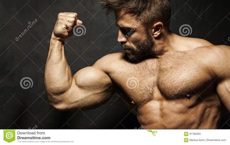 Muscular Man Flexing His Biceps Stock Photos Download