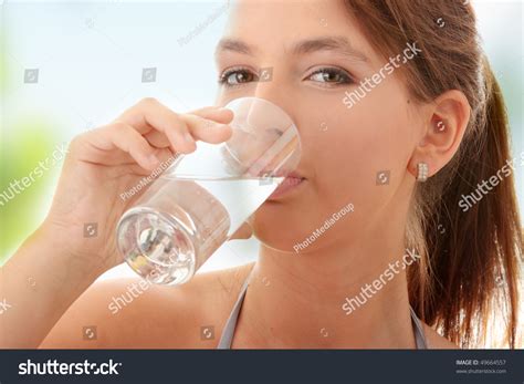 Young Woman Drinking Fresh Cold Water From Glass Stock Photo 49664557