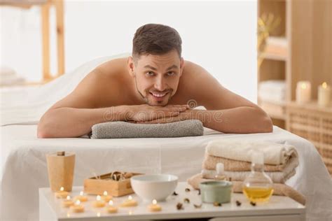 Man Lying On Massage Table In Spa Salon Stock Image Image Of Therapy