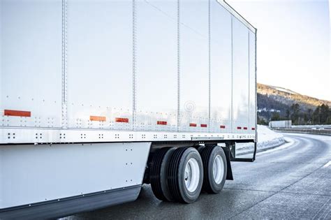 Big Rig Semi Truck Transporting Cargo In Dry Van Semi Trailer With
