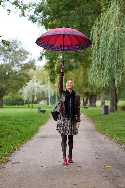 Premium Photo Funny Happy Short Haired Blonde Woman Walking In The Autumn Park With Huge Red