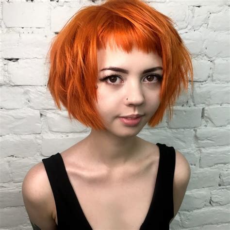 Short Choppy Bob With Micro Bangs And Messy Straight Texture On Fiery Sunset Orange Colored Hair