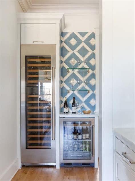 I researched for a long time for a dual zoned, right dimension, quite, bottom condenser, with a locked fridge. A glass front wine fridge is fitted beneath a white ...