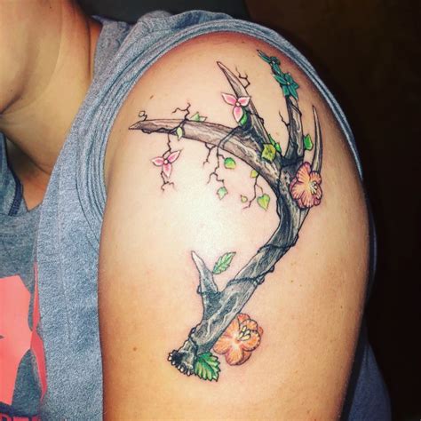 Some people use company or brand logos that depict a deer as their logo. Deer antler with flowers tattoo | Deer antler tattoos ...