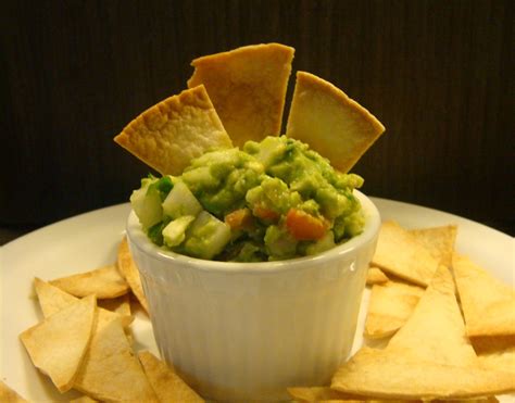 Place sliced tortilla, oil and salt in a large bowl. Homemade Tortilla Chips & Guacamole Dip - Dish by Dish