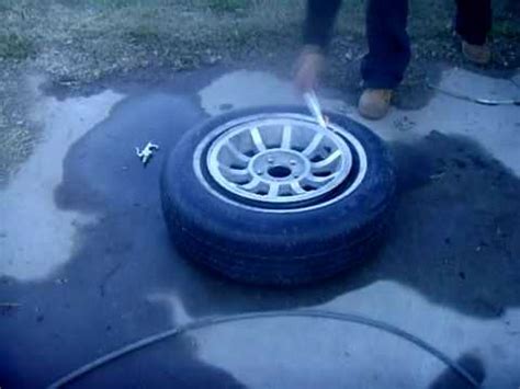 It is time for you to mount the new one on the rim. HOW TO PUT A CAR TIRE ON A RIM THE MEXICAN WAY PART2 (THE ...