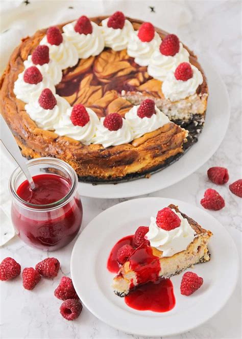 The creamy cheesecake is loaded with coconut, white chocolate and cream cheese. White Chocolate Raspberry Swirl Cheesecake | Lil' Luna
