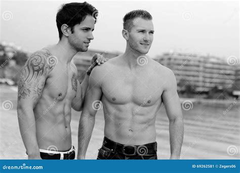 two men posing on the beach stock image image of muscular beautiful 69262581