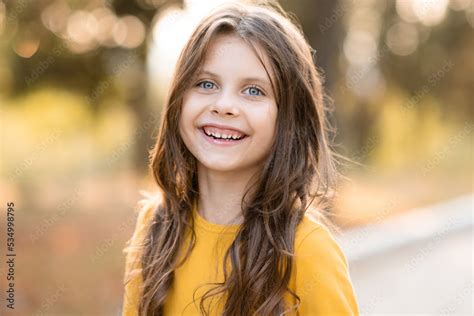 Laughing Child Girl 5 6 Year Old With Long Blonde Hair Over Nature