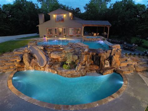 Two Level Luxury Pool With Waterfalls Slide Swim Up Bar And Spa
