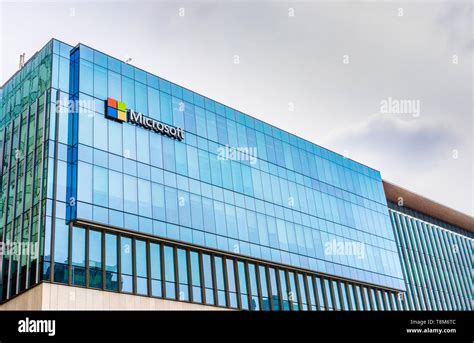 Exterior View Of Microsoft Corporation Logo On Glass Windowed West Side