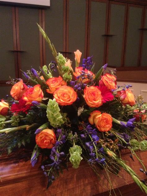 1 florist is a premium florist located in orange county. Casket spray orange blue red | Funeral flower arrangements ...