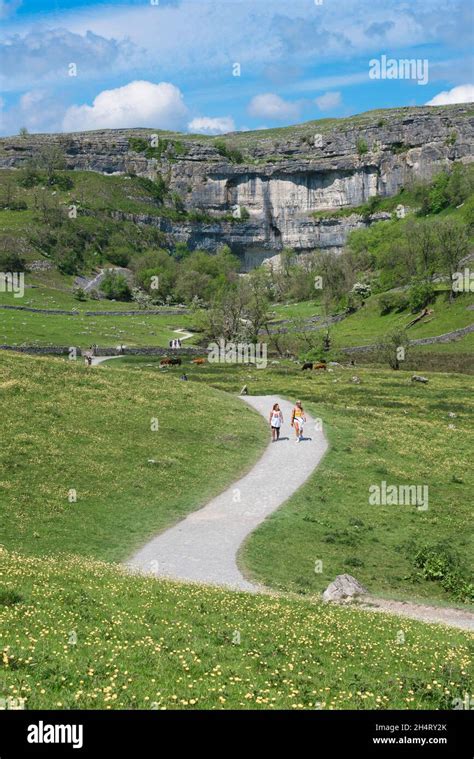 Pennine Way Yorkshire View In Summer Of People Walking A Section Of