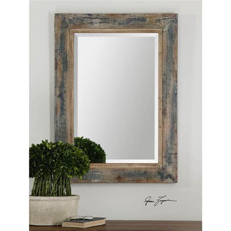 Crafted from metal, this mirror's round frame features three layers of stamped medallions in rich hues of dark green, blue, and ivory. Global Direct 38 in. x 28 in. Aged Blue Framed Mirror ...