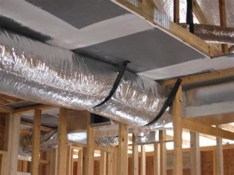 It is easier than you might think. Duct work is strapped to the chase ceiling | Building ...