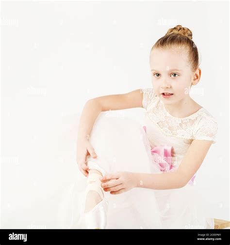 Beautiful Ballet Dancer Isolated On White Background Slender Little Ballerina Girl In White