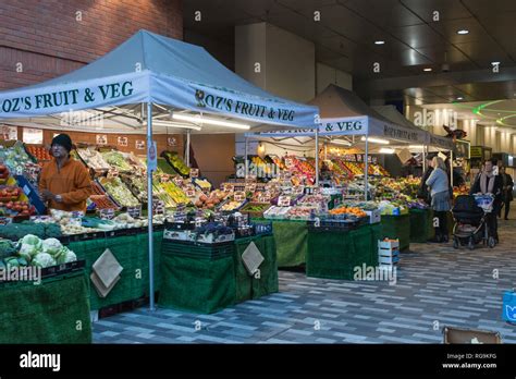 Fruit And Vegetable Market Stalls On Market Walk In Woking Town Centre