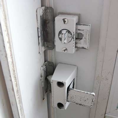 You probably have little latches at the bottom of each. Emco Forever Storm Door hardware, Discontinued